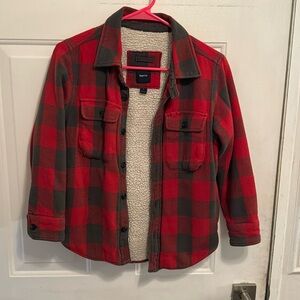 Red and gray insulated, gap flannel size medium youth. Small snag on the back.